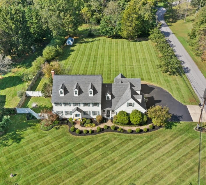 Aerial view of manicured lawn with diagonal stripes